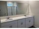 Bathroom with double vanity and large mirror at 334 Rover Rd, Ormond Beach, FL 32174
