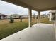 Covered patio with a view of the backyard and neighboring homes at 334 Rover Rd, Ormond Beach, FL 32174