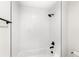 Bright bathroom featuring subway tile shower with black hardware at 634 Burch Ave, Winter Garden, FL 34787