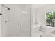 Bathroom with a glass-enclosed shower, soaking tub, and a large vanity at 634 Burch Ave, Winter Garden, FL 34787
