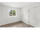 Bright bedroom with a double door closet and modern floors at 634 Burch Ave, Winter Garden, FL 34787