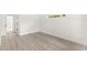 Bedroom with laminate flooring, bright walls, and a view through the window at 634 Burch Ave, Winter Garden, FL 34787