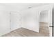 Bright bedroom with modern floors and a double closet at 634 Burch Ave, Winter Garden, FL 34787