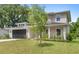 Attractive home with a modern design, a two-car garage, and a professionally landscaped front yard at 634 Burch Ave, Winter Garden, FL 34787