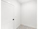 Clean hallway with decorative patterned flooring and a crisp white door at 634 Burch Ave, Winter Garden, FL 34787