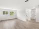 Bright living room featuring wood floors, natural light, and neutral walls at 634 Burch Ave, Winter Garden, FL 34787