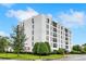 Modern condominium building with landscaped grounds at 213 E Canton Ave # 213, Winter Park, FL 32789