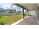 A covered back porch offers a relaxing outdoor space overlooking a well-maintained yard and neighboring homes at 5249 Stone Ridge Pl, St Cloud, FL 34771