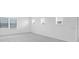 Spacious bedroom with neutral carpet and multiple windows offering ample natural light, creating an airy atmosphere at 5249 Stone Ridge Pl, St Cloud, FL 34771