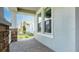 Covered front porch featuring brick pillars and a railing at 5249 Stone Ridge Pl, St Cloud, FL 34771