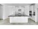 Open kitchen design with large island, modern appliances, and ample counter space at 5249 Stone Ridge Pl, St Cloud, FL 34771