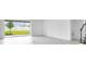 Living room with sliding glass doors to backyard and staircase at 5249 Stone Ridge Pl, St Cloud, FL 34771