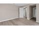 Bedroom featuring luxury vinyl plank flooring and white doors at 11045 Belmere Isles Ct, Windermere, FL 34786