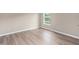 Bedroom featuring hardwood flooring and a window for natural light at 11045 Belmere Isles Ct, Windermere, FL 34786