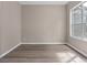Neutral bedroom features a window that allows for natural light with a closet to the side at 11045 Belmere Isles Ct, Windermere, FL 34786