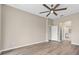 Spacious bedroom with luxury vinyl plank flooring leads to the bathroom at 11045 Belmere Isles Ct, Windermere, FL 34786