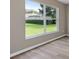 Bedroom featuring luxury vinyl plank flooring and a large window at 11045 Belmere Isles Ct, Windermere, FL 34786