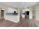 Bright open kitchen featuring white cabinets, stainless steel appliances, and a breakfast bar at 11045 Belmere Isles Ct, Windermere, FL 34786