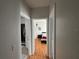 Hallway with wood floors leading to bedrooms and bathroom at 2740 Maitland Crossing Way # 2-303, Orlando, FL 32810