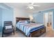 Main bedroom with king bed and ensuite bathroom at 4670 Links Village Dr # B405, Ponce Inlet, FL 32127