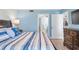 Spacious bedroom with king bed and dresser at 4670 Links Village Dr # B405, Ponce Inlet, FL 32127