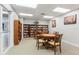 Community room with tables, chairs, and a library at 4670 Links Village Dr # B405, Ponce Inlet, FL 32127