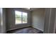 Bedroom with window and wood-look flooring at 1109 East Pkwy, Deland, FL 32724