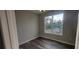 Bedroom with wood-look flooring and a window at 1109 East Pkwy, Deland, FL 32724