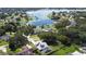 Scenic aerial view of a lakeside community with lush greenery and beautiful waterfront homes at 11209 Crescent Bay Blvd, Clermont, FL 34711