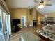 Bright living room with hardwood floors, a fireplace, and sliding glass doors to the patio at 2939 Falling Tree Cir, Orlando, FL 32837