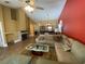 Spacious living room with a stone fireplace, ceiling fan, and plenty of natural light at 2939 Falling Tree Cir, Orlando, FL 32837