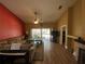 Open floor plan living room featuring a cozy sectional and outdoor access at 2939 Falling Tree Cir, Orlando, FL 32837