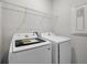 Convenient laundry room featuring a side-by-side washer and dryer at 524 Orient Ave, Debary, FL 32713