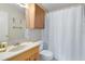 Clean bathroom with a vanity, shower, and linen cabinet at 4621 N Pine Hills Rd # 113, Orlando, FL 32808