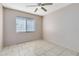 Empty bedroom with tile flooring and a ceiling fan at 4621 N Pine Hills Rd # 113, Orlando, FL 32808