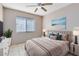 Bright bedroom with a ceiling fan and neutral decor at 4621 N Pine Hills Rd # 113, Orlando, FL 32808