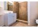 Bathroom featuring tiled shower, modern vanity, and updated fixtures, offering a clean aesthetic at 10557 Glassborough Dr, Orlando, FL 32825