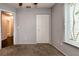 Bedroom with neutral walls, a window with blinds, and a closet for storage at 10557 Glassborough Dr, Orlando, FL 32825