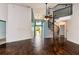 Bright living room with high ceilings, spiral staircase, wood-look flooring, and plenty of natural light at 10557 Glassborough Dr, Orlando, FL 32825