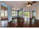 Spacious living area showcasing wood-look floors and a seamless flow to the outdoor patio area at 10557 Glassborough Dr, Orlando, FL 32825