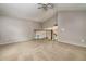 Carpeted loft featuring a railing overlooking the lower level, perfect for flexible living at 10557 Glassborough Dr, Orlando, FL 32825