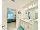 Bright bathroom featuring dual sinks with a view into the bedroom at 1393 Asher Mason Ave, Kissimmee, FL 34744