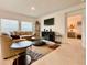 Inviting living room with comfortable seating, large TV, and a view into another room at 1393 Asher Mason Ave, Kissimmee, FL 34744