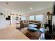 Open-concept living room with adjacent kitchen, tile flooring, and plenty of natural light at 1393 Asher Mason Ave, Kissimmee, FL 34744