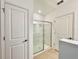 Modern bathroom shower with glass doors, clean tile, and contemporary fixtures at 1393 Asher Mason Ave, Kissimmee, FL 34744
