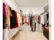 Large walk-in closet featuring clothing rods and a full length mirror at 1393 Asher Mason Ave, Kissimmee, FL 34744