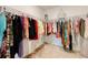 Spacious walk-in closet featuring an abundance of hanging storage and organization at 1393 Asher Mason Ave, Kissimmee, FL 34744