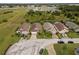 Aerial view of homes featuring attached garages, screened lanais, and manicured lawns in a desirable neighborhood at 246 Kimberly Point Dr, Davenport, FL 33837