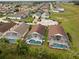 Bird's-eye view featuring the pool homes with screened-in patios, offering a glimpse of outdoor enjoyment in a community at 246 Kimberly Point Dr, Davenport, FL 33837