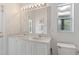 Bathroom features dual sinks, vanity, and natural light at 246 Kimberly Point Dr, Davenport, FL 33837